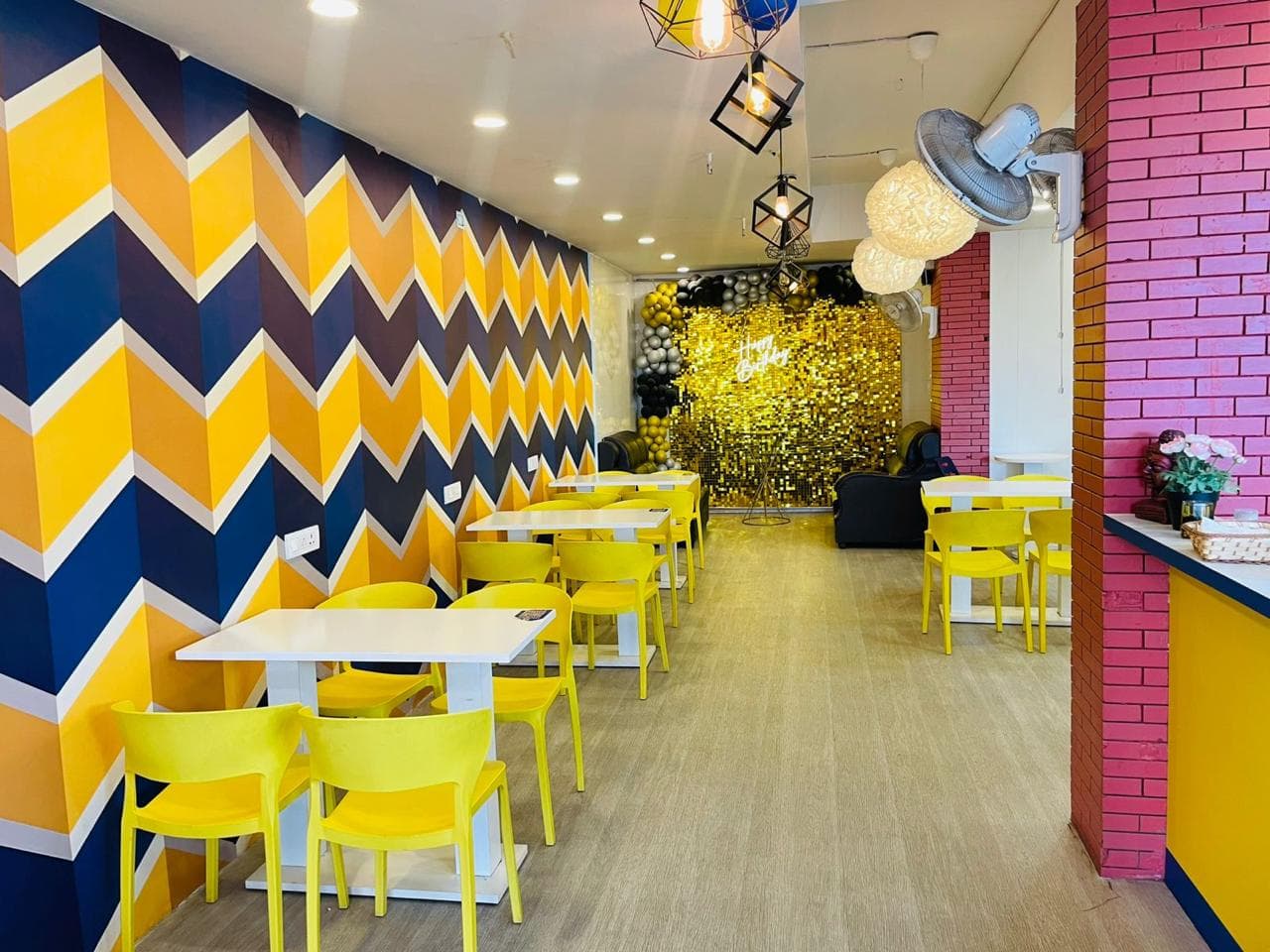 Hangout Café interior with tables, chairs and warm lighting