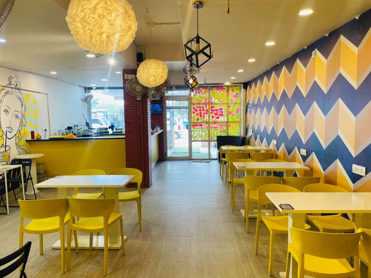 Hangout Café dining area with tiled walls and seating